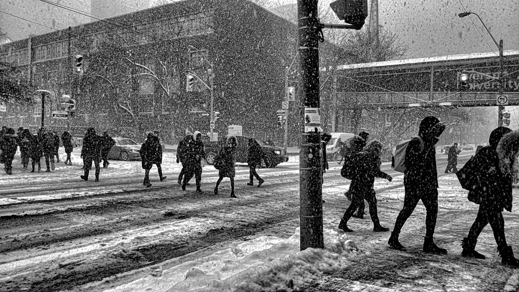 Pedestrians crossing a snowy street