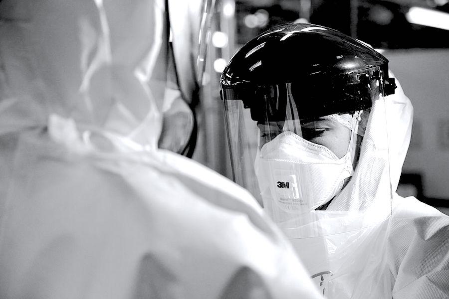 Health worker in a mask and visor